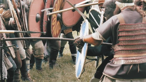 Knight warriors in battle. Medieval soldiers in full armor in melee combat