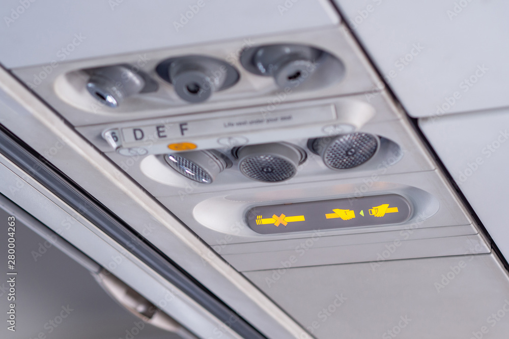 Fototapeta premium No smoking and fasten seat belt sign in airplane