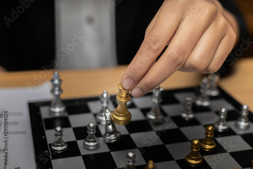 Business woman Chess financial business strategy concept. Business women moving chess figure with team behind. chess to defeat and kill.
