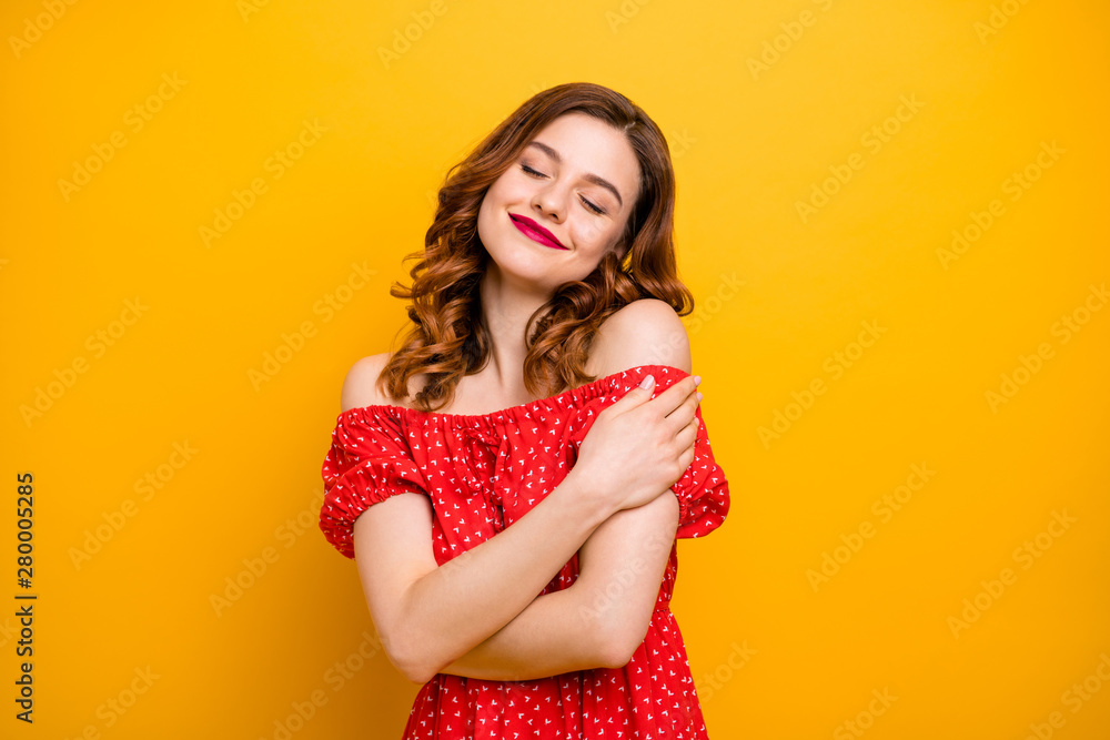 Pretty foxy lady overjoyed look hold herself in hands close eyes wear dress with open shoulders isolated yellow background Pretty foxy lady overjoyed look hold herself in hands close eyes wear dress with open shoulders isolated yellow background