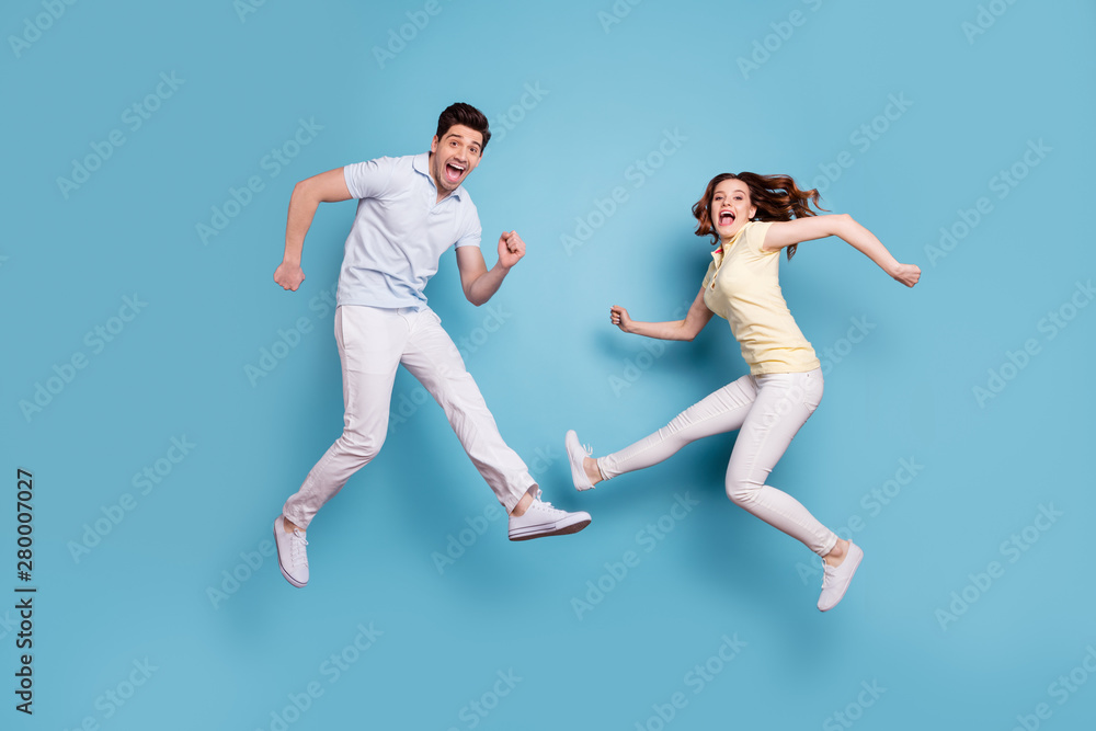 Full length body size view of nice-looking attractive lovely playful childish carefree cheerful cheery people having fun fooling rejoicing isolated over bright vivid shine blue green background Full length body size view of nice-looking attractive lovely playful childish carefree cheerful cheery people having fun fooling rejoicing isolated over bright vivid shine blue green background