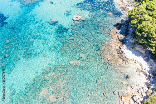 Aerial view of beautiful rocky coastline with turquoise sea water..