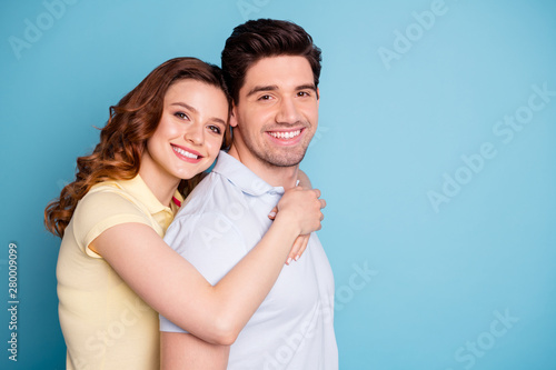 Close-up profile side view portrait of his he her she nice attractive lovely sweet cheerful cheery people wearing casual on honey moon vacation isolated over bright vivid shine blue green background