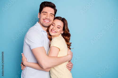 Photo of pair in love celebrating valentine day hugging slow dance wear casual t-shirts isolated blue background