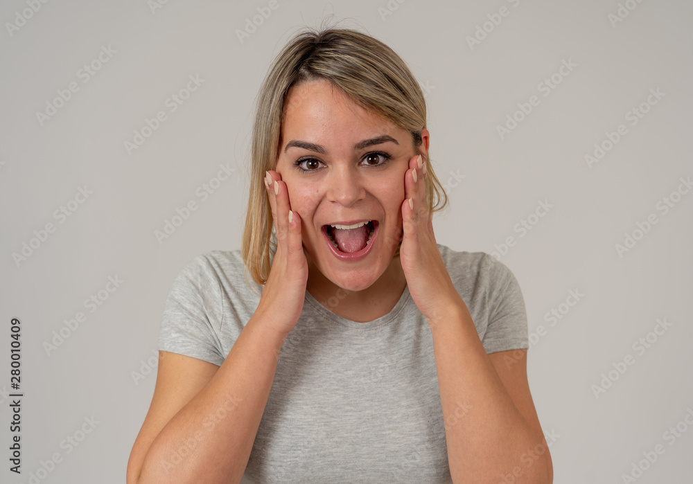 Fototapeta premium Portrait of surprised and happy woman celebrating victory and winning lottery in human emotions
