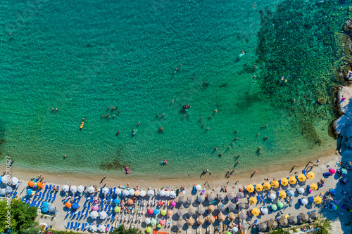 Aerial View of the Aliki Beach with colorful umbrellas, at Thassos island, Greece photo