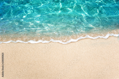 Soft blue ocean wave or clear sea on clean sandy beach summer concept © OHishi_Foto