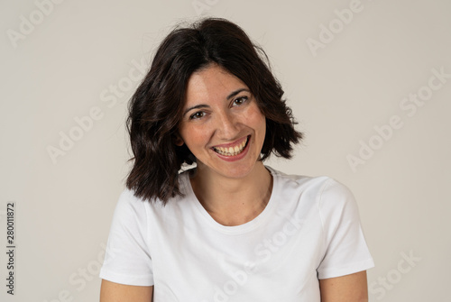 Portrait of young attractive cheerful woman with smiling happy face in expression of joy