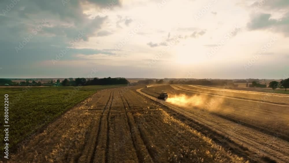 Drone view of combine harvester during seasonal work Drone view of combine harvester during seasonal work
