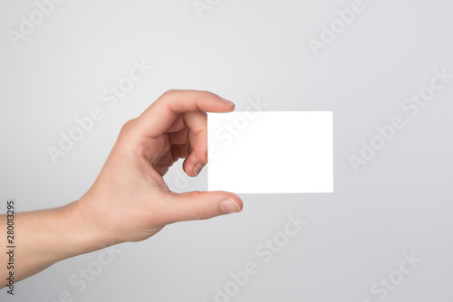 hand holding blank business card