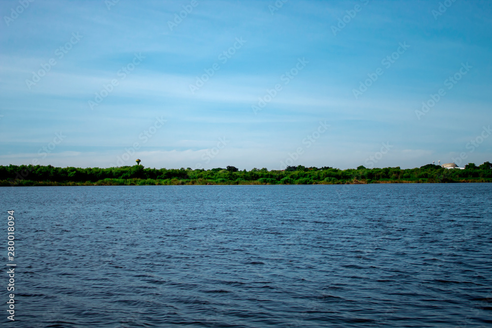 Wide lake in the blue sky