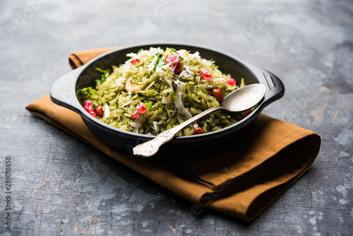 Hariyali Poha / Green Masala Pohe or flattened rice served in a bowl, selective focus