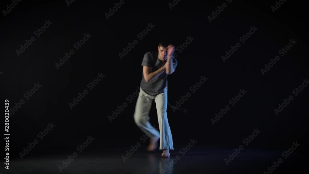 Strong man performing incredibly complex of martial art of capoeira. Strong man performing incredibly complex of martial art of capoeira.