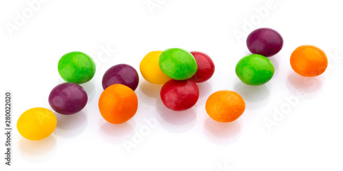 Multicolor shiny nuts and raisins dragee isolated on white background