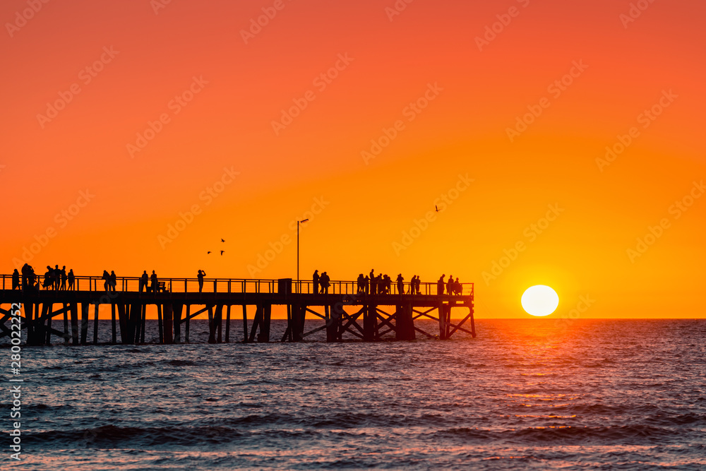 Semaphore jetty with people at sunset