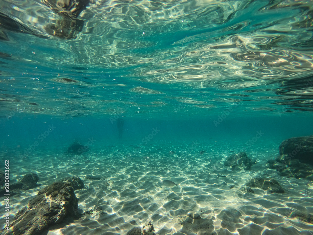 Underwater view of sea bottom with sand, rocks and stones.. Underwater view of sea bottom with sand, rocks and stones..