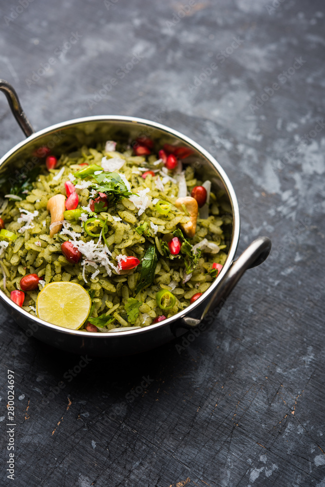 Hariyali Poha / Green Masala Pohe or flattened rice served in a bowl, selective focus Hariyali Poha / Green Masala Pohe or flattened rice served in a bowl, selective focus