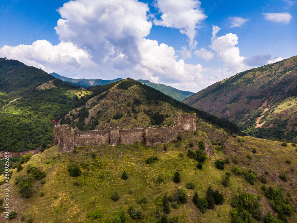 Ruins of medieval fortress Maglic on top of hill by the Ibar river in Serbia. Aerial view. Valley of this river is also called Lilac valley. Ruins of medieval fortress Maglic on top of hill by the Ibar river in Serbia. Aerial view. Valley of this river is also called Lilac valley.