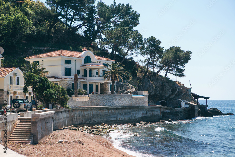 View of traditional coastal villas or houses near the seashore in Petrovac in Montenegro.
