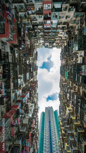 Hong Kong, China - May 19, 2019: Looking up at old building to sky in perspective view Architecture of Yick Fat Building located in east of Hong Kong's Central Business District