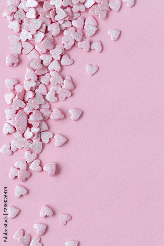 Pink valentine day background with pink hearts, top view