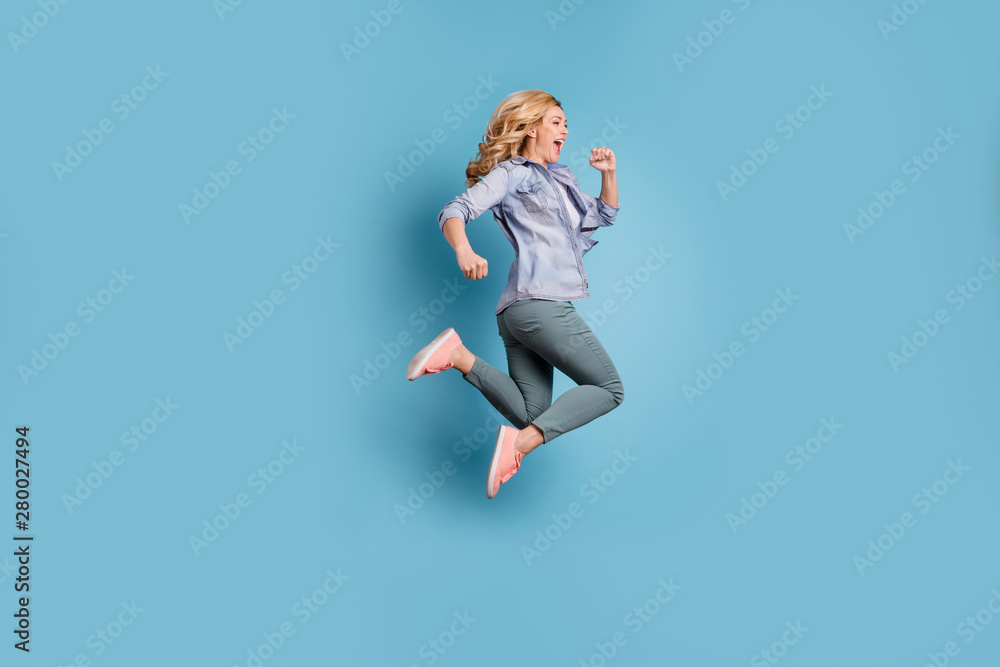 Profile side full length photo of delighted person shouting wearing pants trousers isolated over blue background
