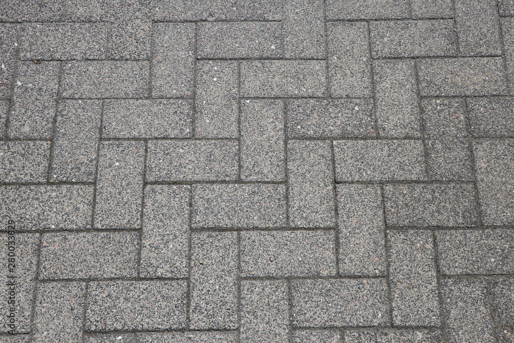 Herringbone pattern, abstract background with pavers on an urban walkway