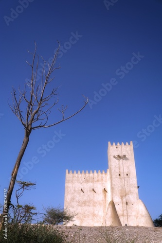 View of Barzan Towers(Umm Salal Mohammed Towers) were constructed in late 19th century and rebuilt in 1910 by Sheikh Mohammed bin Jassim Al Thani in Doha, Qatar  photo