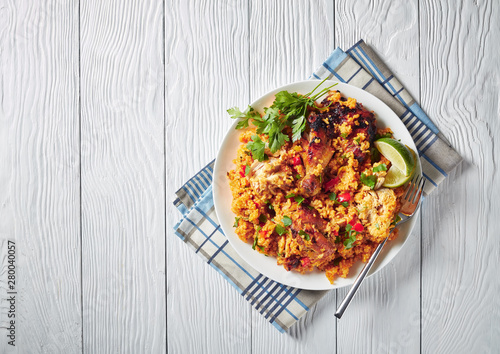 Arroz con pollo, chicken with rice and veggies photo