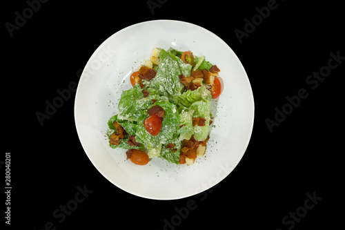 Breakfast as caesar salad on white plate, focus selective.