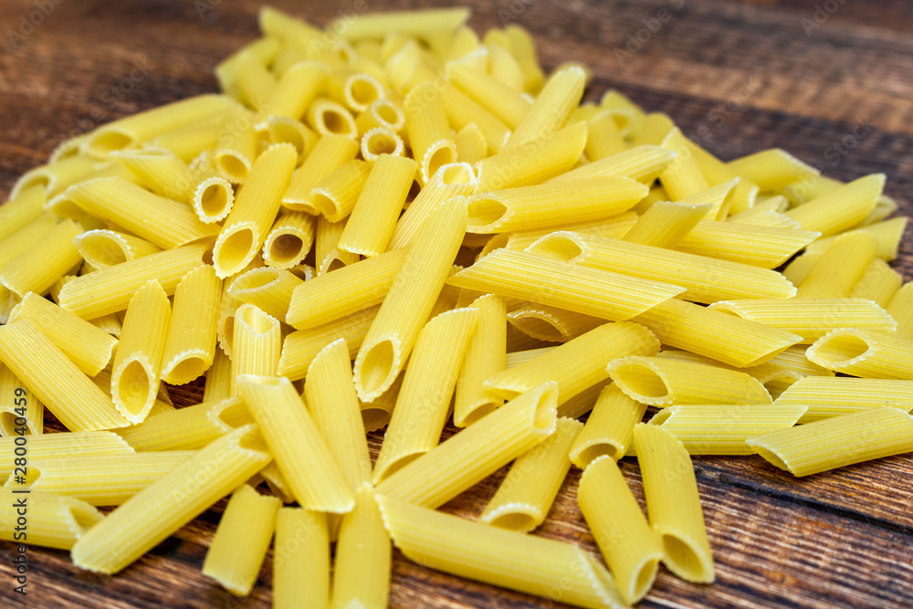 spaghetti, maccheroni, penne, macaroni, pasta traditional Italian on wooden background close up selective focus spaghetti, maccheroni, penne, macaroni, pasta traditional Italian on wooden background close up selective focus