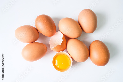 Fresh eggs from the farm placed on a white wooden table background