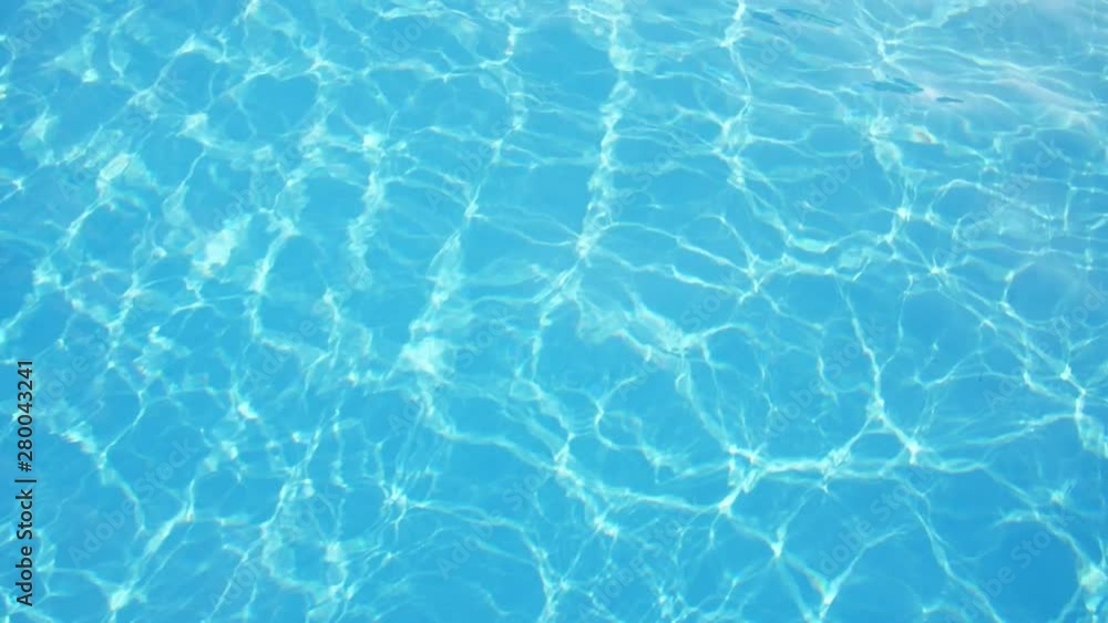 Arty celeste swimming pool waters with shimmering sunny rays in slow motion Arty celeste swimming pool waters with shimmering sunny rays in slow motion