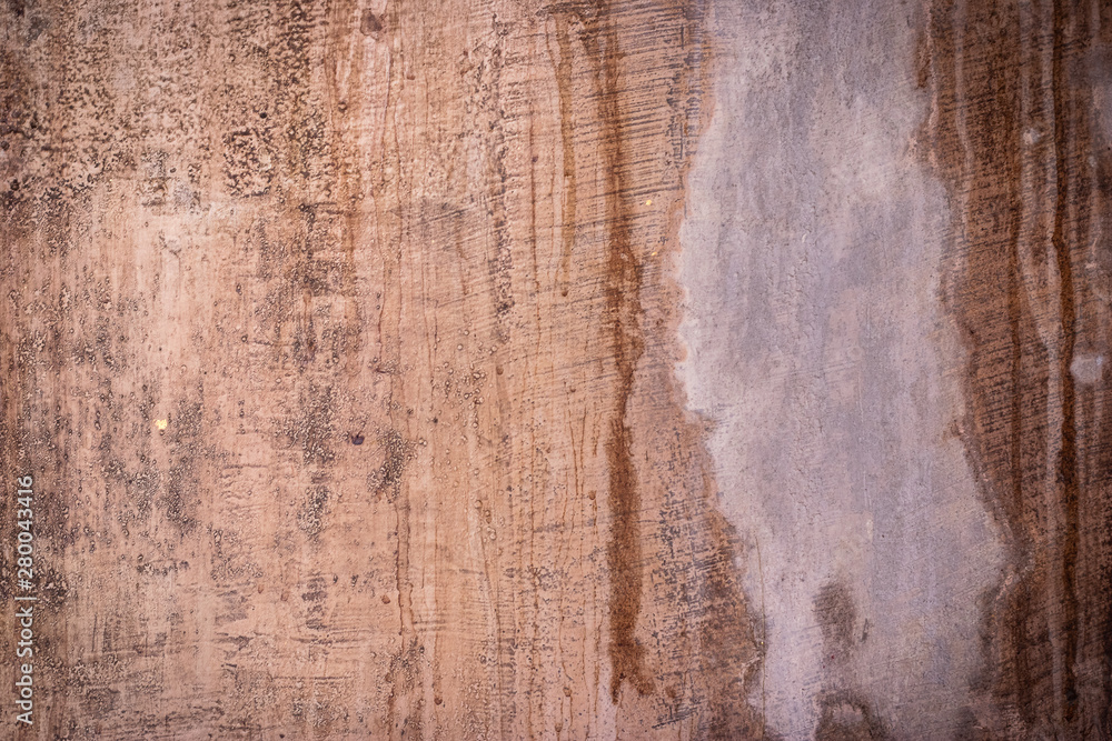 Fototapeta premium Red dirty plaster wall. Ancient background and texture.