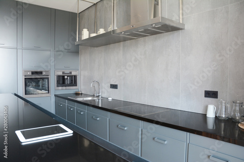 Modern kitchen with faucet, kitchen hood, mirror, oven. Modern Smart Kitchen