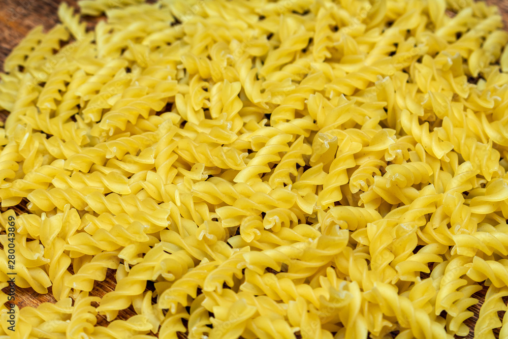 spaghetti, fusilli, macaroni, pasta traditional Italian on wooden background close up selective focus spaghetti, fusilli, macaroni, pasta traditional Italian on wooden background close up selective focus