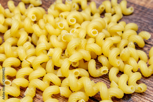 spaghetti, cavatappi, macaroni, pasta traditional Italian on wooden background close up selective focus