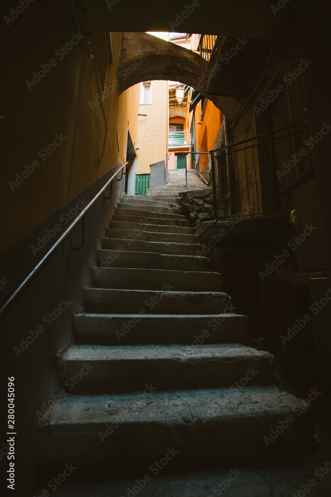 Narrow streets in Riomaggiore town at Cinque Terre, Italy in the summer