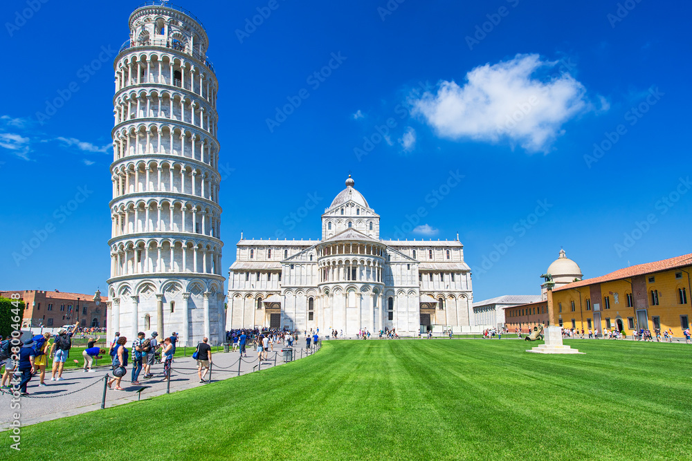 View of the Leaning Tower and the Pisa Cathedral in sunny day, Italy