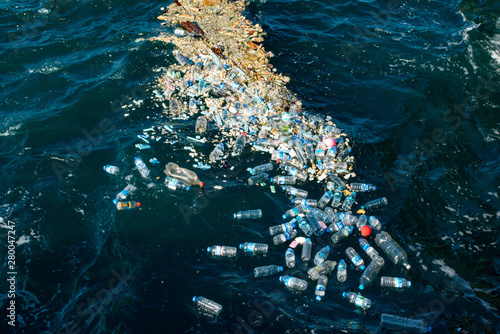 Plastic water bottles pollute ocean © EwaStudio