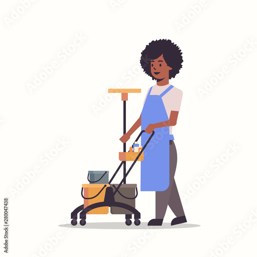 woman holding trolley cart with supplies african american female cleaner janitor in uniform cleaning service concept flat full length white background