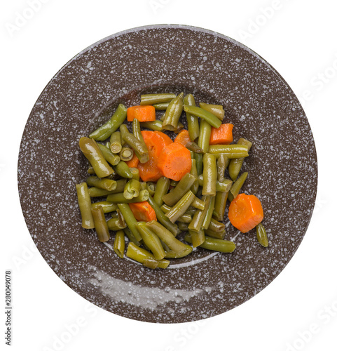 green beans with garlicand carrots  on a plate isolated on white background.green beans with carrot top view. healthy  food photo