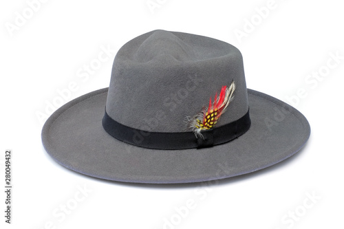 Vintage gray hat fasion with black ribbon and feather isolated on white background. This has clipping path