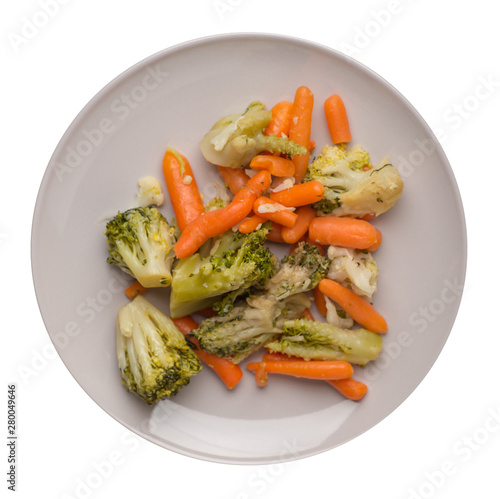 provencal vegetables on a plate.grilled vegetables on a plate isolated on white background.broccoli and carrots on a plate top view.healthy  food