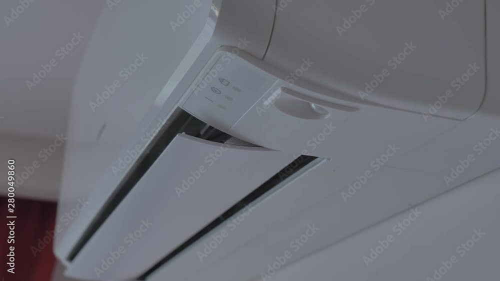 Turning Air Conditioner. Close Up Turning On and Off Air Conditioner Turning Air Conditioner. Close Up Turning On and Off Air Conditioner