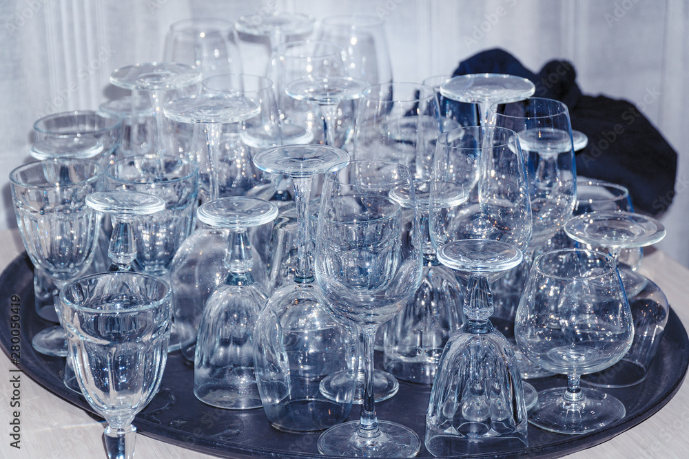 Many of Clean empty wine glasses on the table. Soft focus Many of Clean empty wine glasses on the table. Soft focus