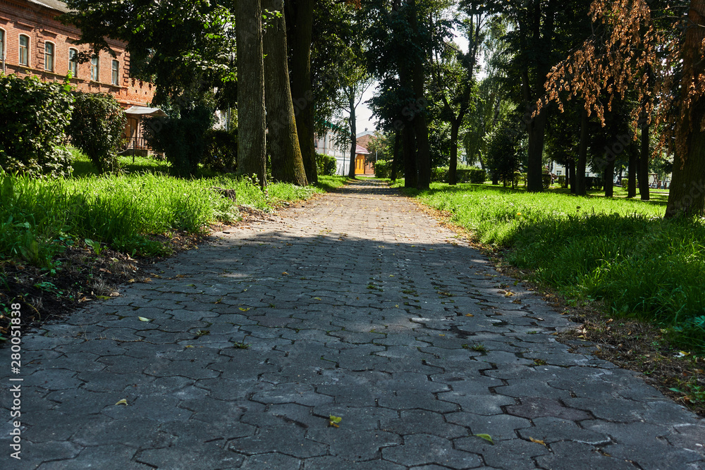 The sidewalk paved with brick blocks goes with the prospect of a distance. Comfortable straight the sidewalk The sidewalk paved with brick blocks goes with the prospect of a distance. Comfortable straight the sidewalk