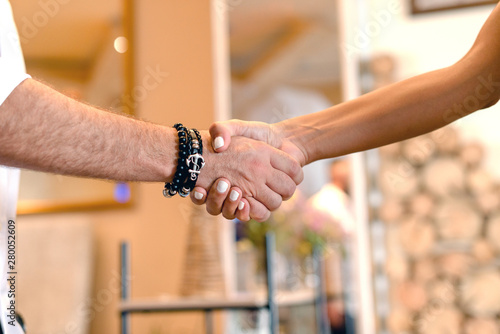 Closeup of shaking hands over a deal.