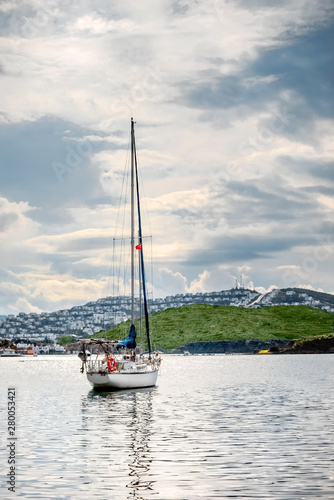 Sailing yacht anchored in Gumusluk bay, Bodrum, Turkey on a cloudy winter day