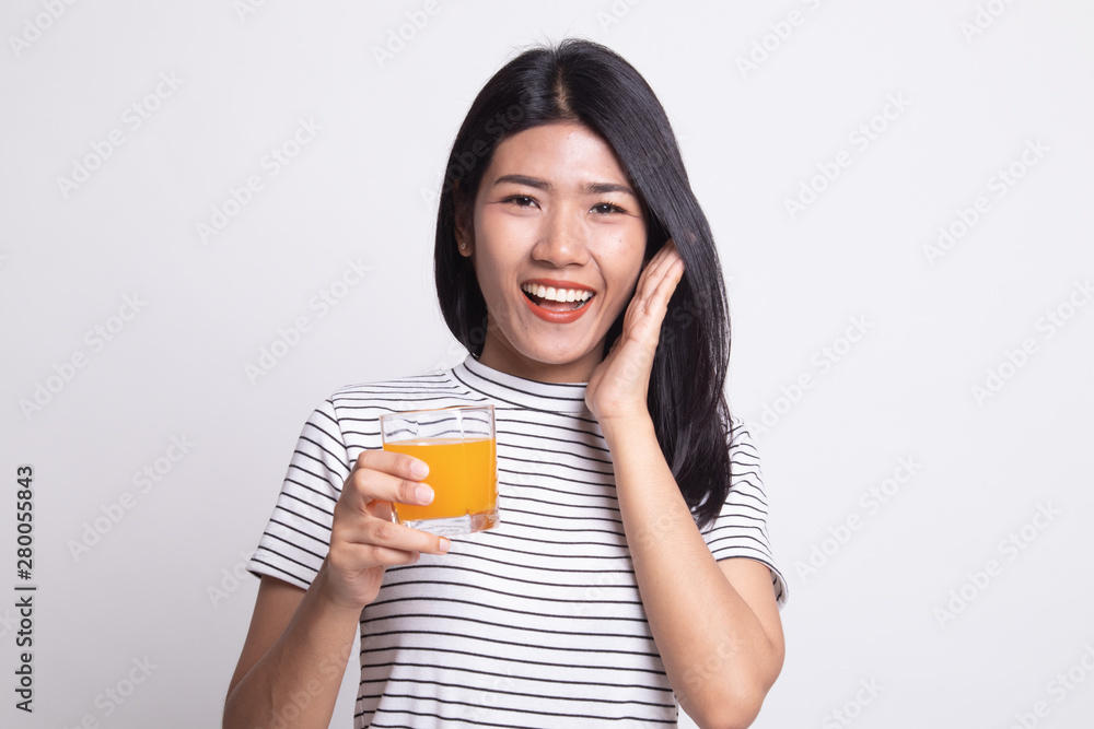 Happy Young Asian woman drink orange juice. Happy Young Asian woman drink orange juice.